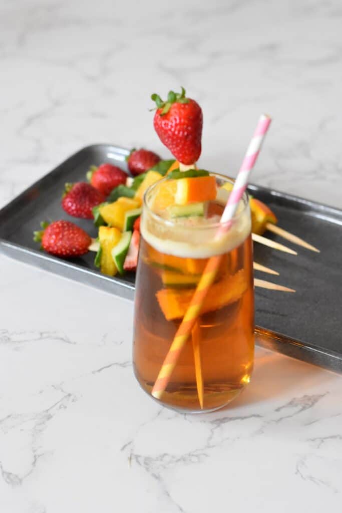 Pimms half and half with a fruit skewer 