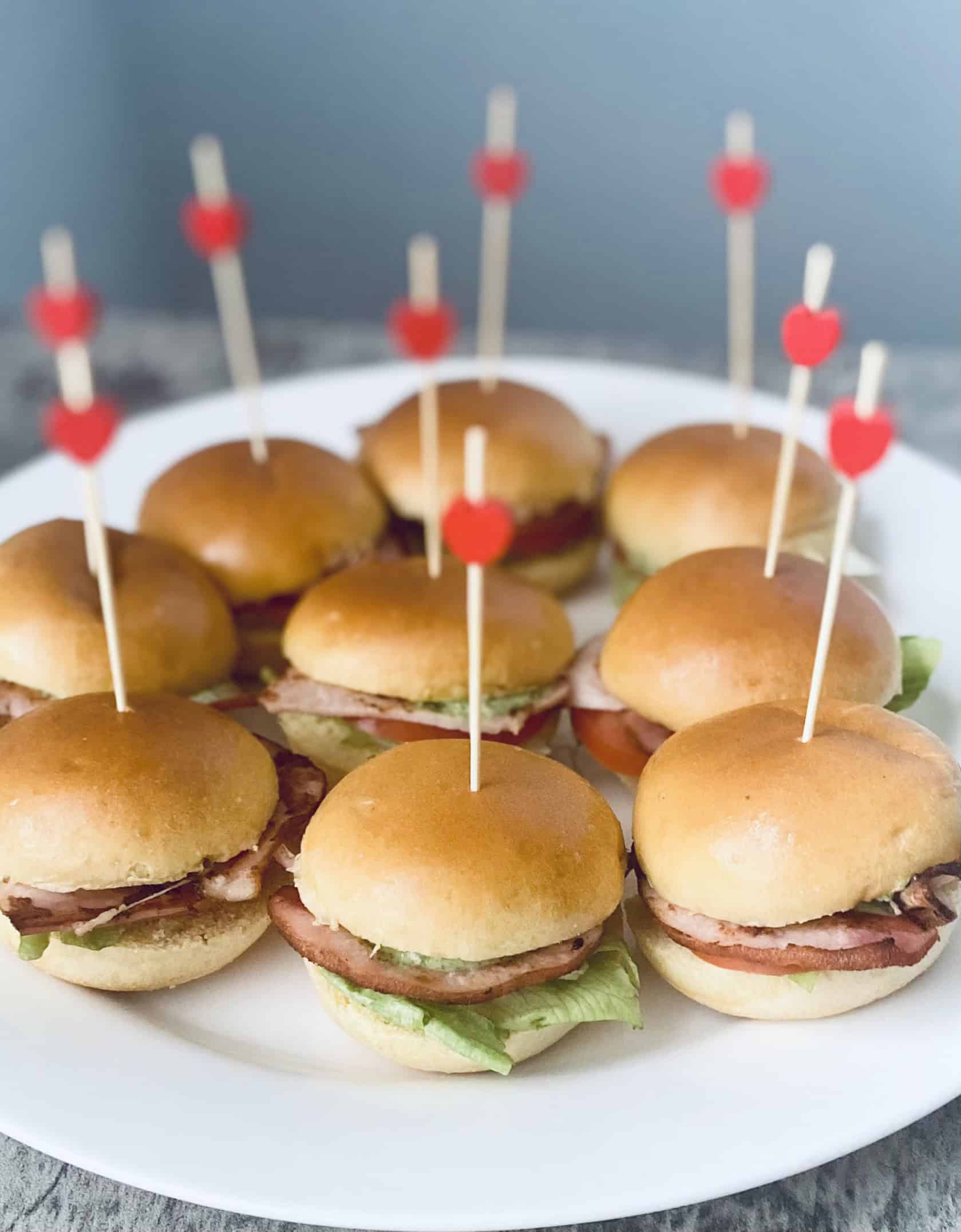 Slider buns with toothpicks topped with love hearts