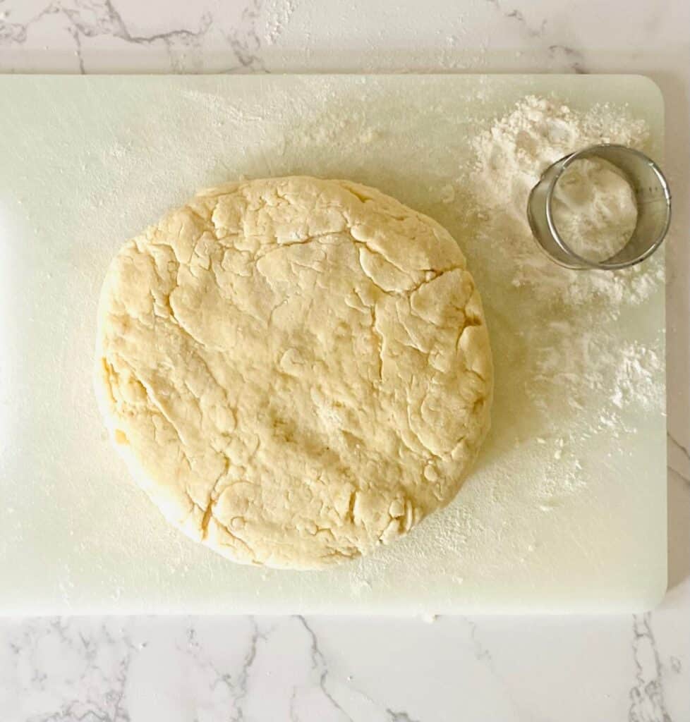 A round of scone dough with a cutter