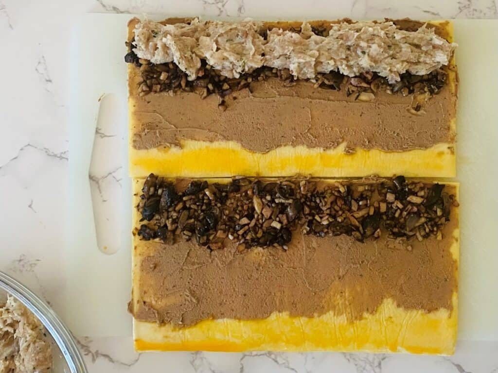 Puff pastry with pate, mushrooms and filling for Chicken Wellington Sausage Rolls