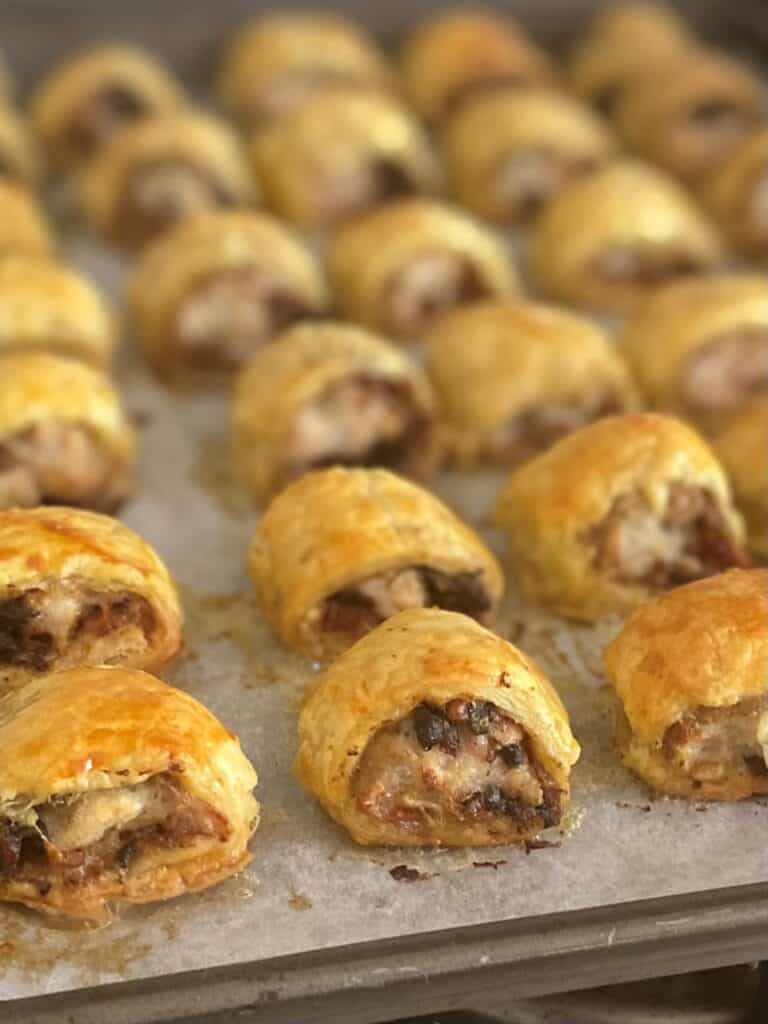 Rows of Chicken Wellington Sausage Rolls fresh from the oven