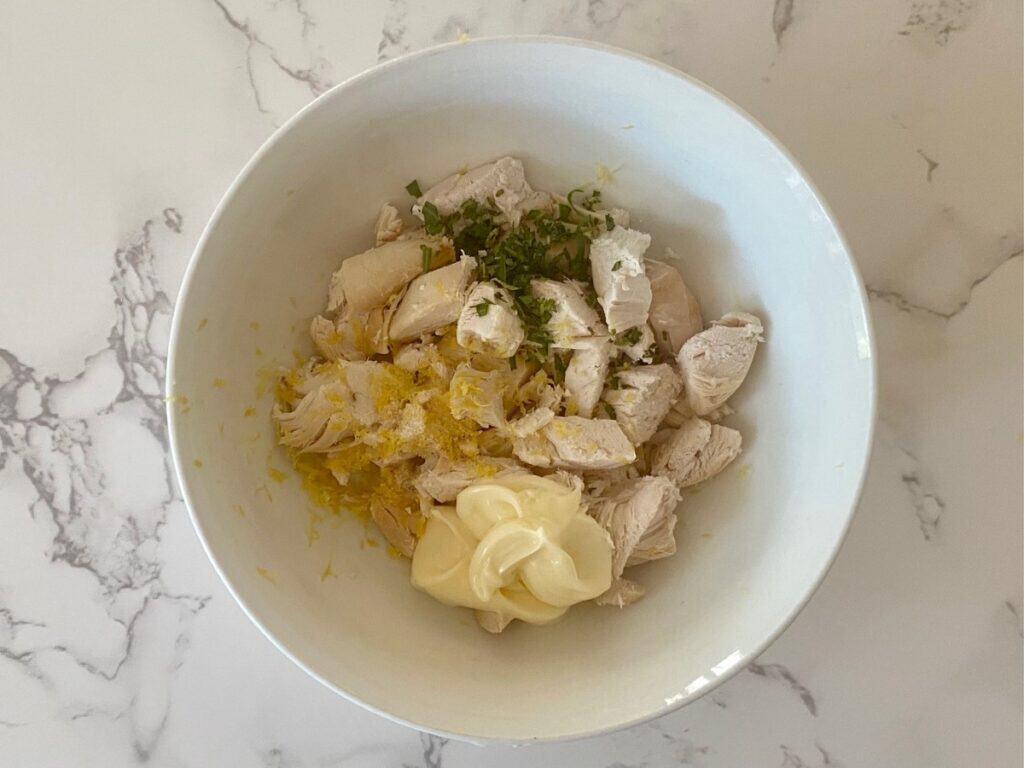 Chopped chicken, tarragon, lemon zest, mayonnaise and salt in a bowl