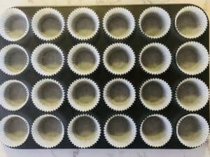 Mini muffin tin lined with cupcake wrappers
