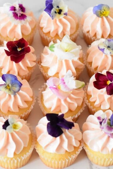 Vanilla cupcakes with edible flowers
