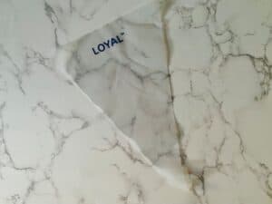 A piping bag sits on a marble bench