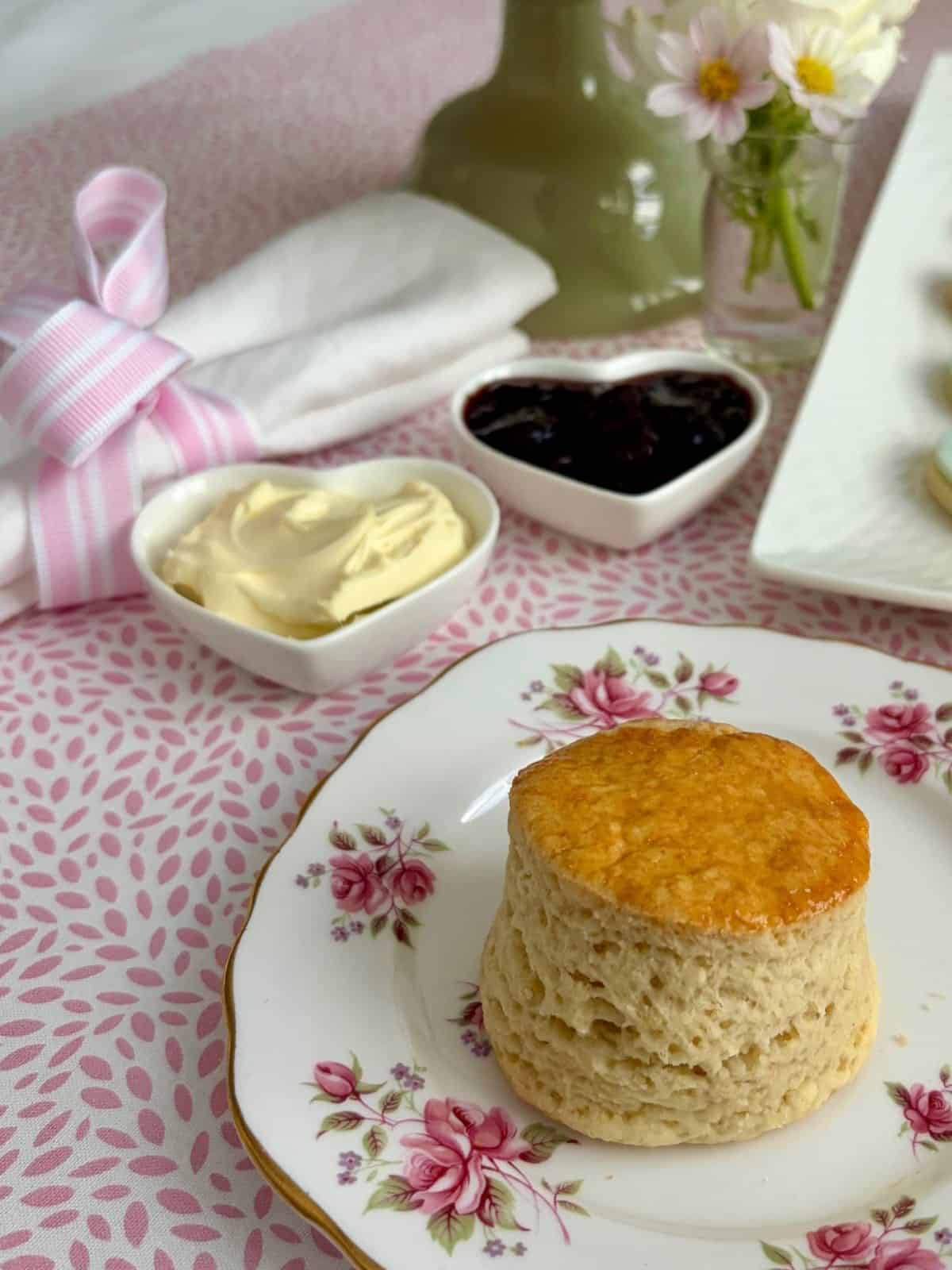 Afternoon Tea scones on a plate with cherry jam and double cream