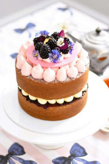 Lemon & Blackberry Sandwich Cake on a cake stand