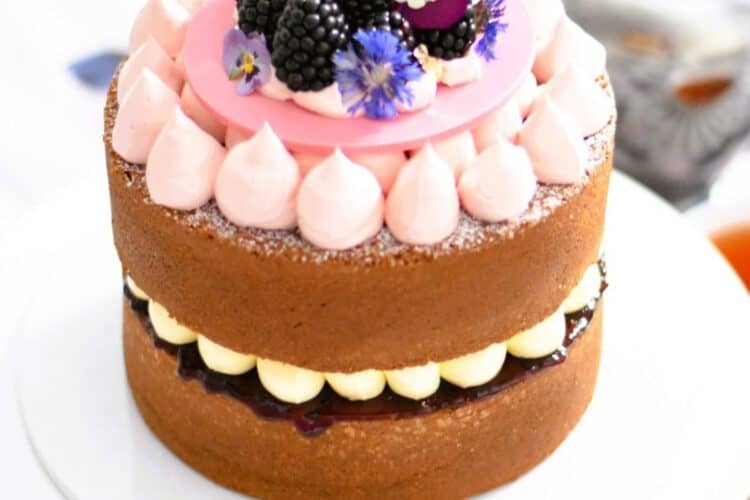 Lemon & Blackberry Sandwich Cake on a cake stand