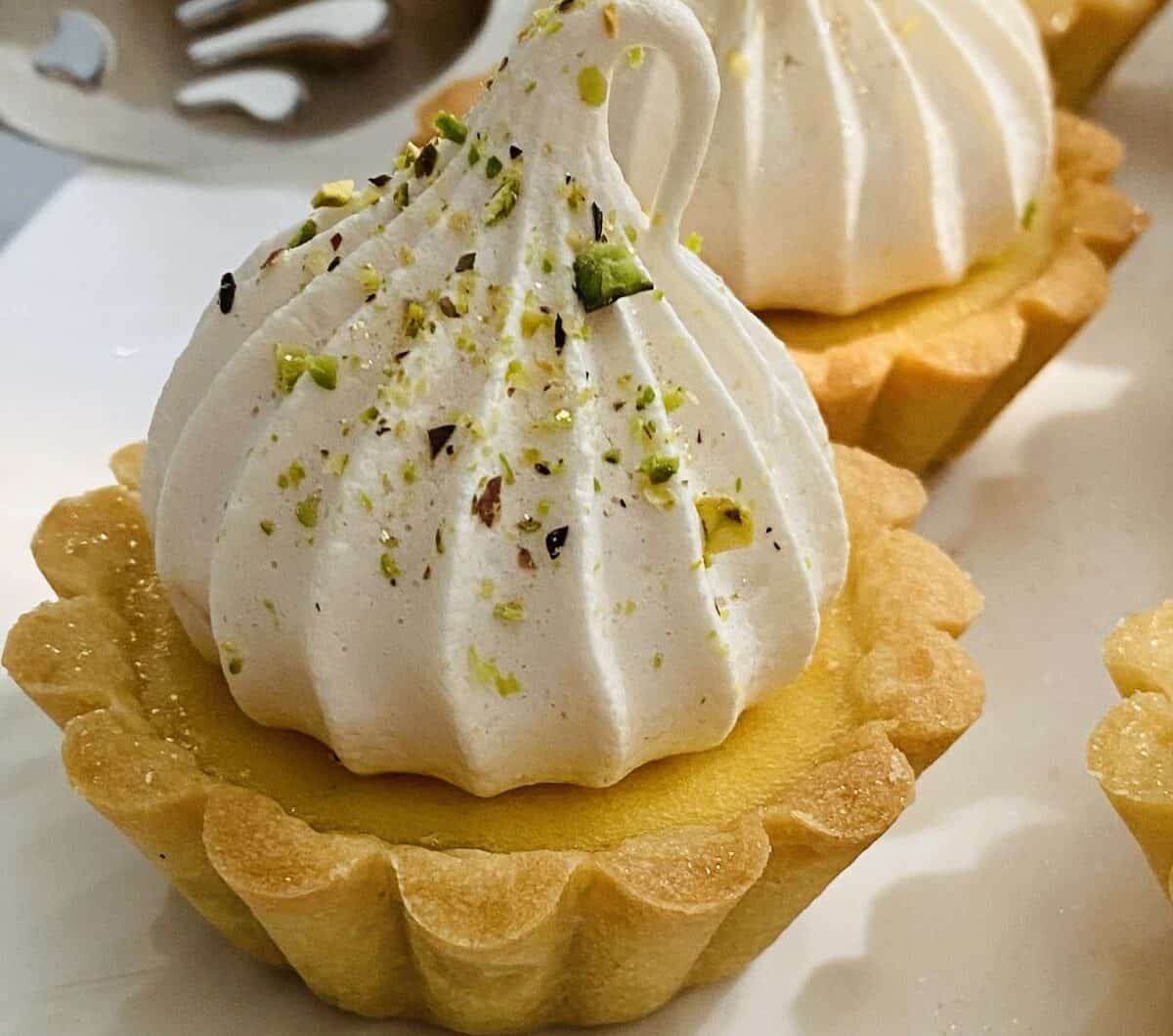 Lemon Tartlets with Pistachio Meringues