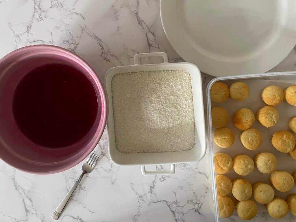 Little raspberry jelly cakes coating ingredients and set up