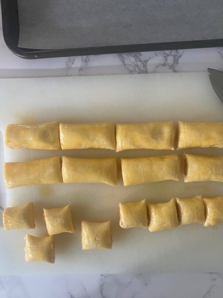 Tiny sausage rolls cut into 8 pieces