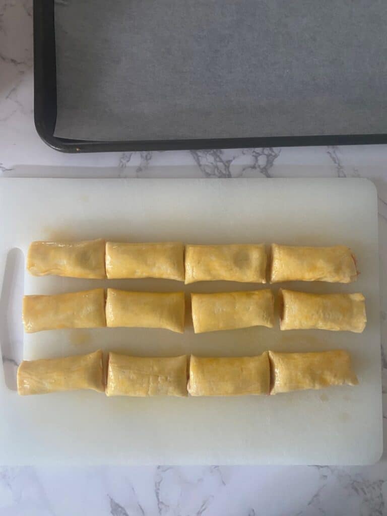 Tiny sausage rolls cut in half