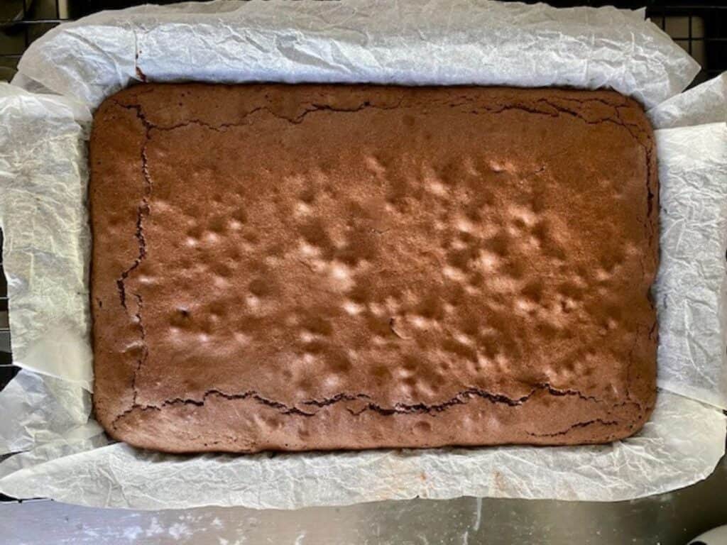 Pistachio Brownies with Pistachio Buttercream cooling in the tray