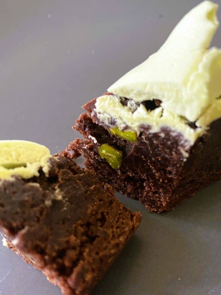 pistachio brownies with pistachio buttercream inside fudgy