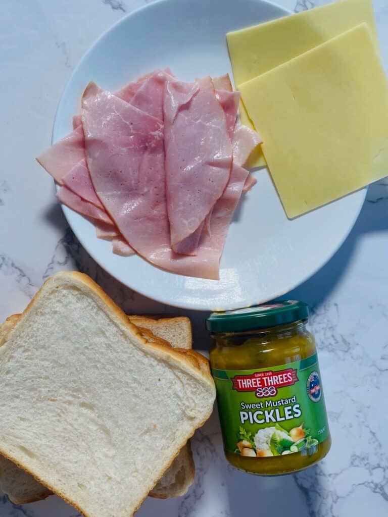 Ingredients for ham cheese & mustard pickle sandwiches