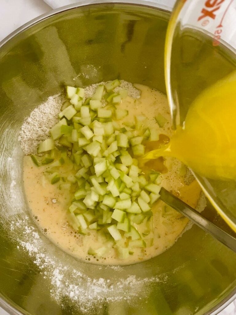 Add the apple to the mixture