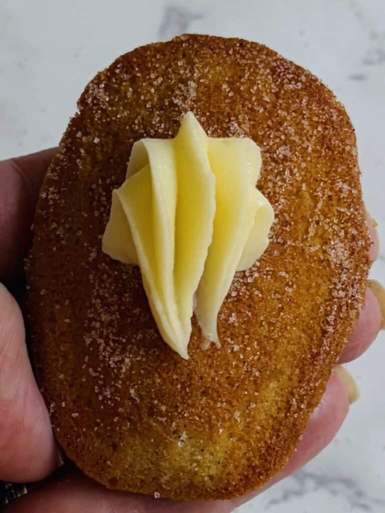 Cinnamon roll madeleine with cream cheese icing