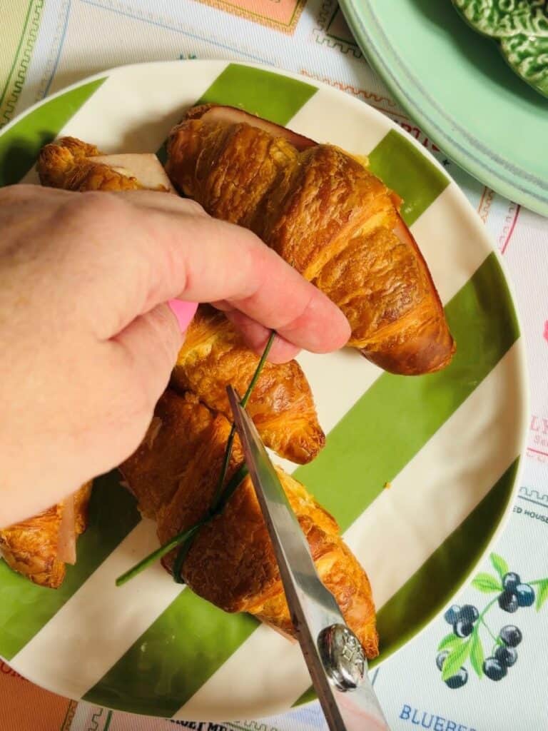 Tie a chive around the mini ham and mustard croissants