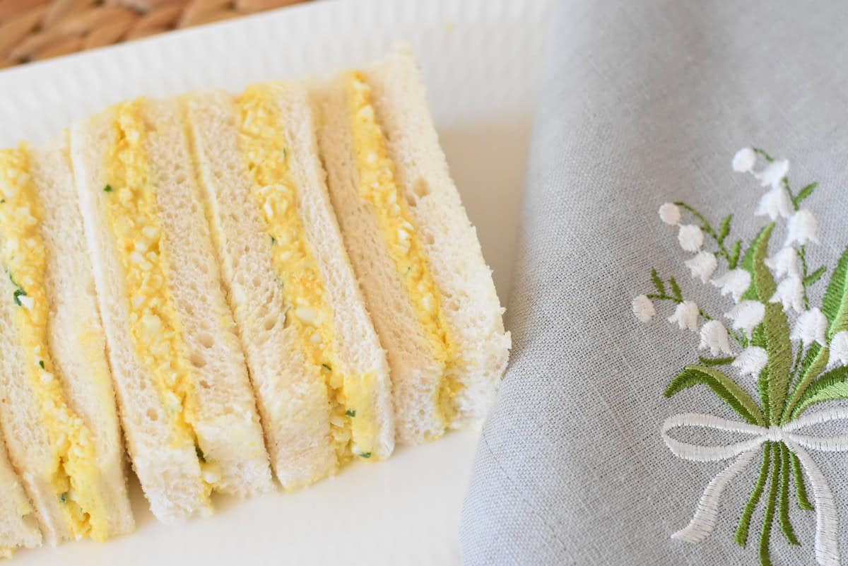 Curried egg finger sandwiches on a platter