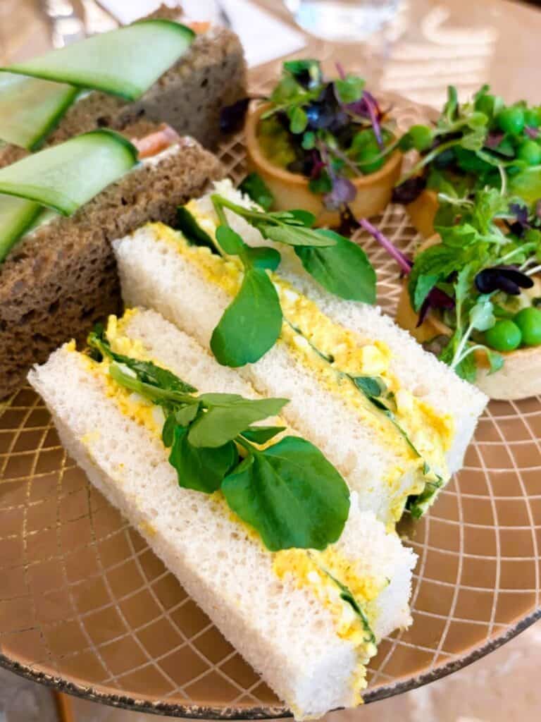 finger sandwiches on a stand