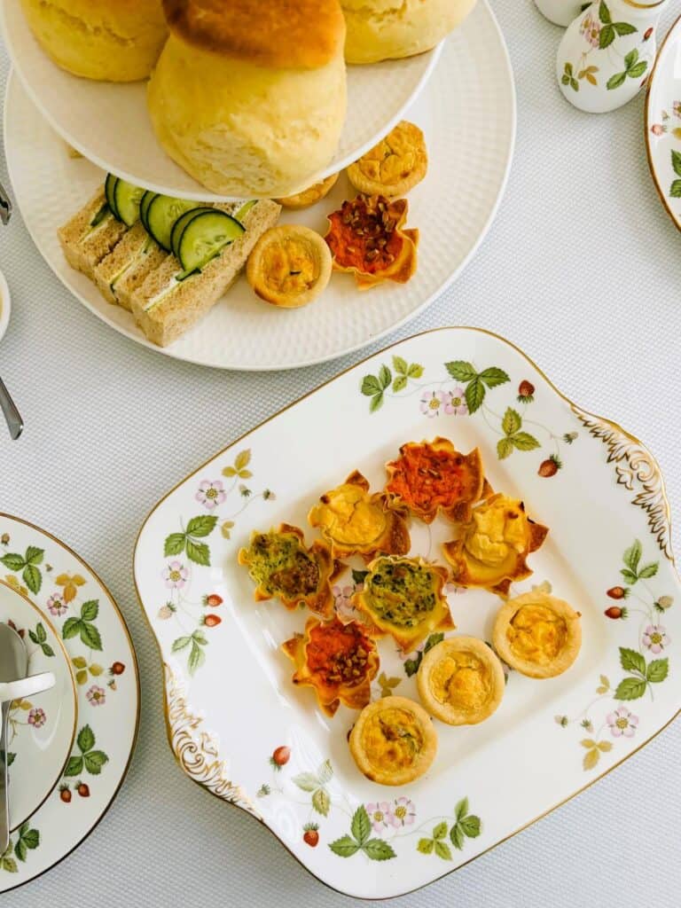 Cheat's afternoon tea savouries on a tiered stand and plate