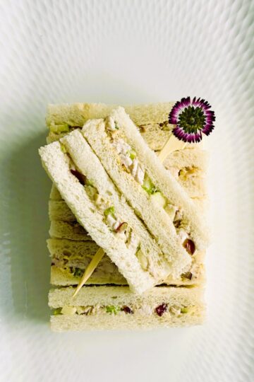 Chicken Waldorf finger sandwiches on a tray