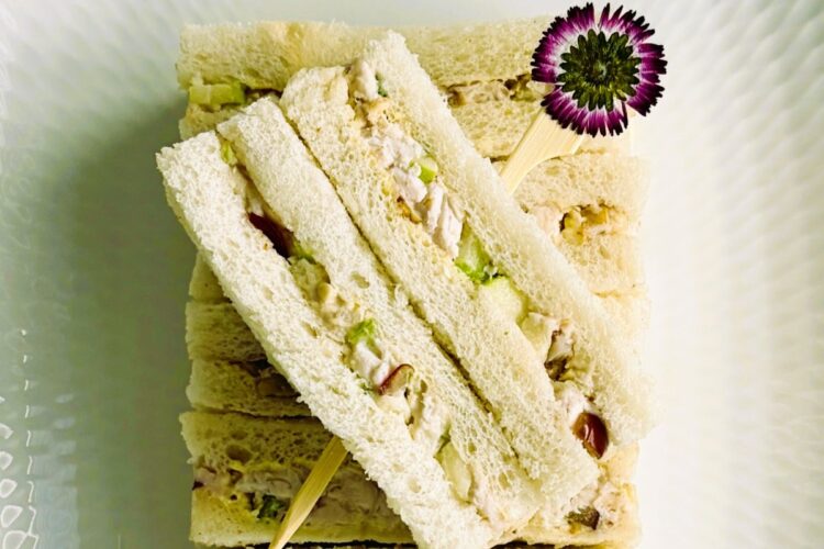 Chicken Waldorf finger sandwiches on a tray