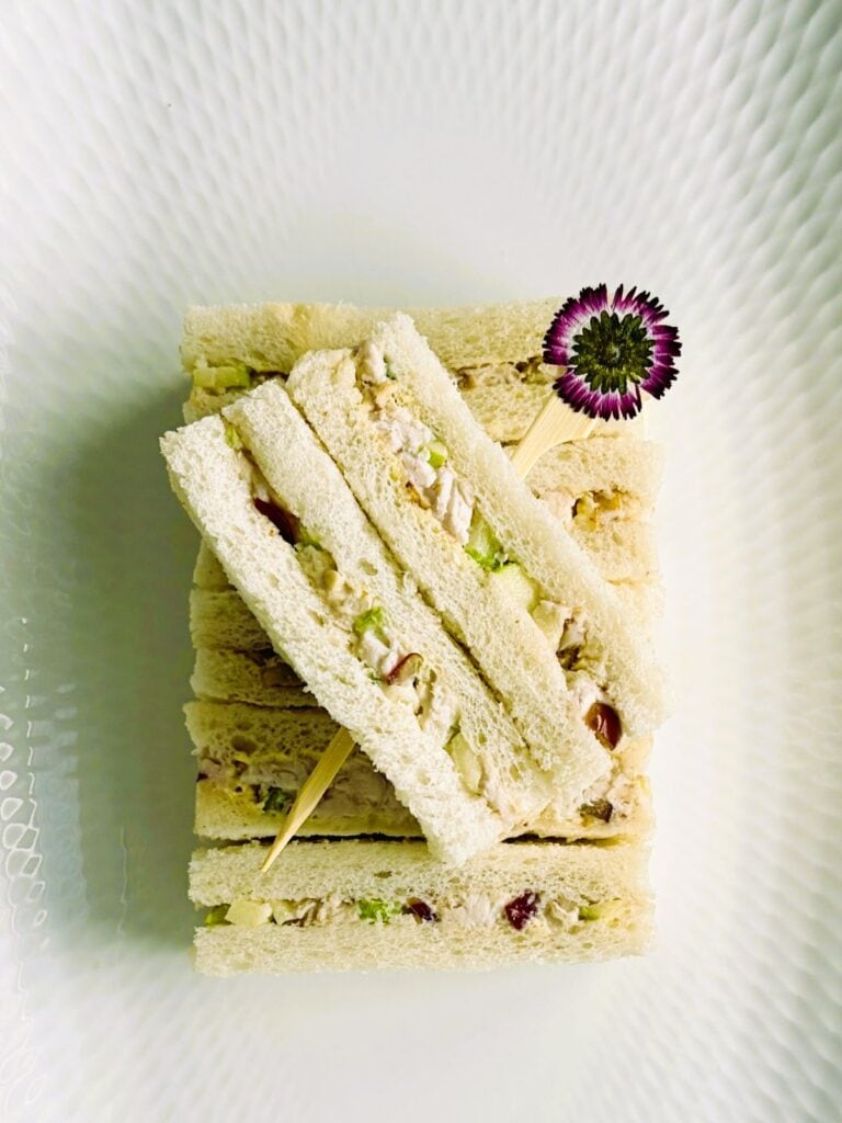 Chicken Waldorf finger sandwiches on a tray