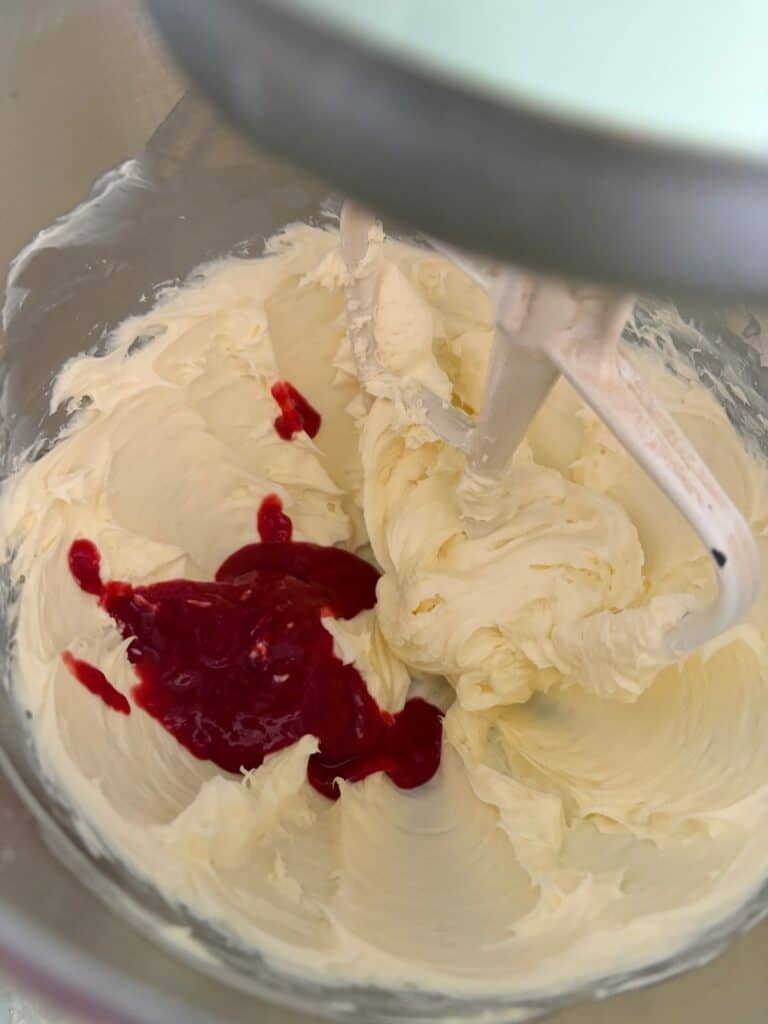 raspberry puree added to cream cheese