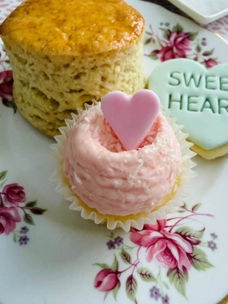 Mini coconut ice cupcakes with little hears with a scone and a cookie