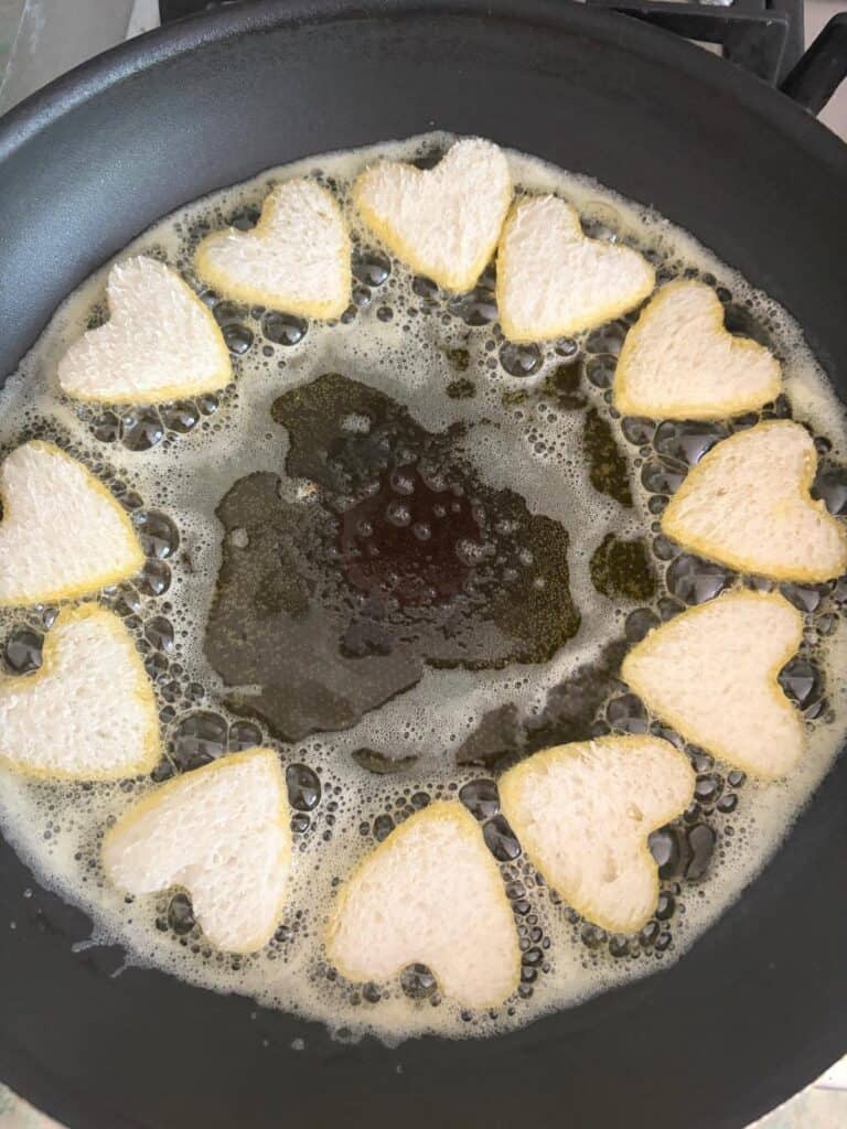 bread hearts frying in clarified butter
