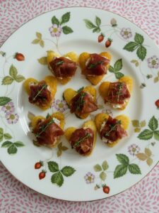 Proscuitto and goat's cheese hearts on a plate