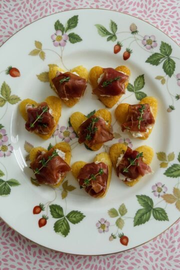 Proscuitto and goat's cheese hearts on a plate