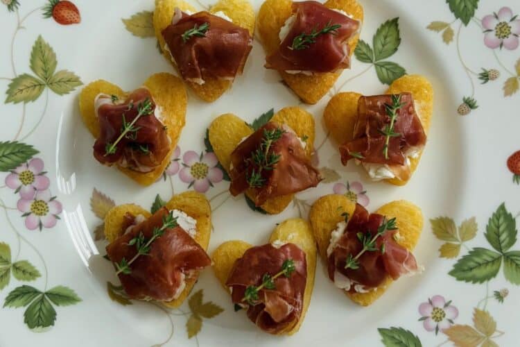 Proscuitto and goat's cheese hearts on a plate
