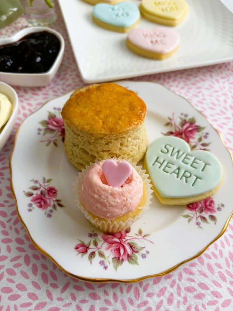 Sweet heart cookie with a mini cupcake and scone on a plate