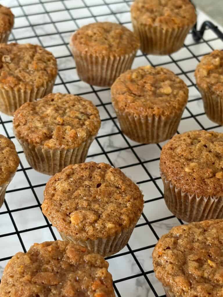 Mini carrot cakes cooling on a cake rack