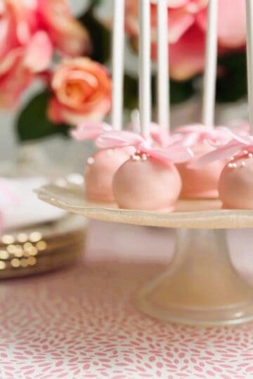 raspberry and coconut truffle pops on a stand