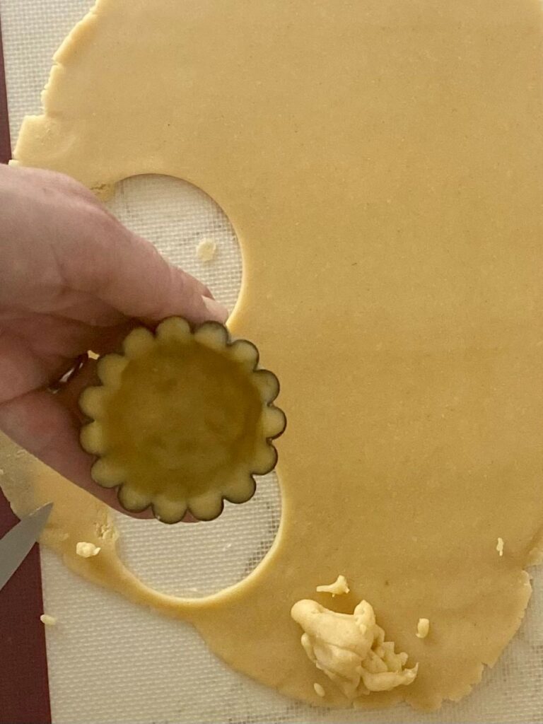 Roll out the dough and line the tart shells