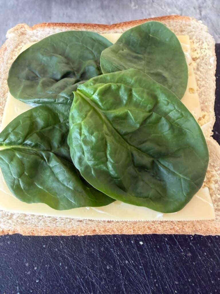 Add baby spinach leaves