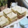 Roast beef and horseradish sandwich squares on a platter