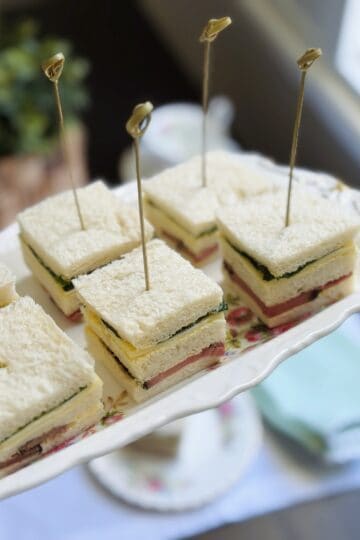Roast beef and horseradish sandwich squares on a platter