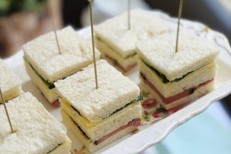 Roast beef and horseradish sandwich squares on a platter