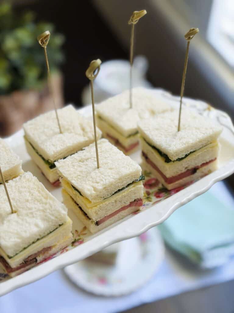 Roast beef and horseradish sandwich squares on a platter