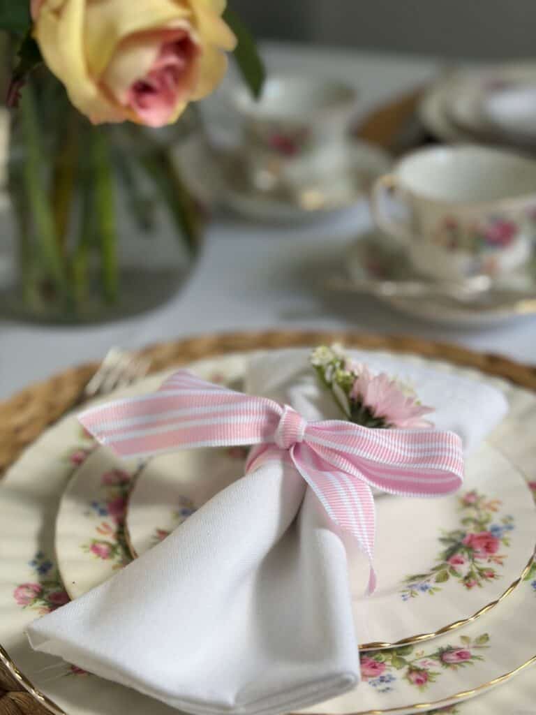 Hosting an afternoon tea at home with a linen Napkin and flowers
